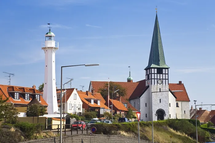 Framed Print : Timber-frame houses, lighthouse and church Skt
