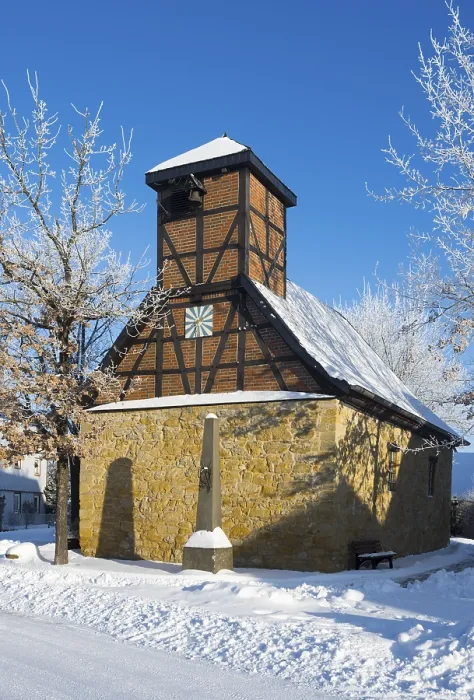 Framed Print : Timbered church in snowcoat with clear blue sky in background