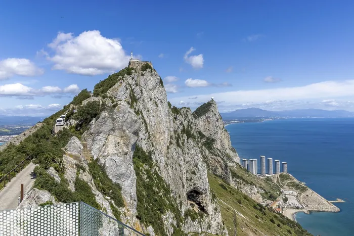 Framed Print : The tip of the Rock of Gibraltar and in the background the Hassan Centenary Terraces residential complex
