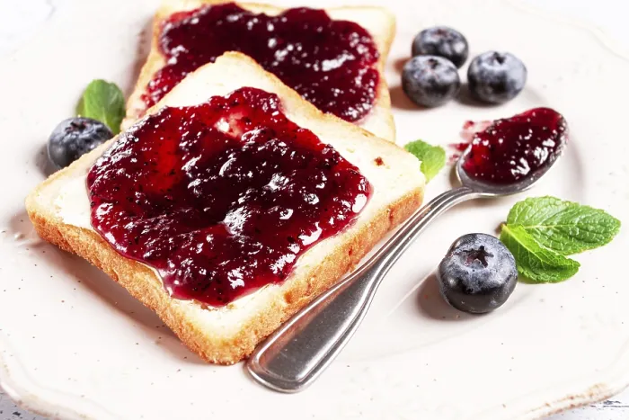 Framed Print : Toast with blueberry jam, on a white plate Framed Print : Toast with blueberry jam, on a white plate