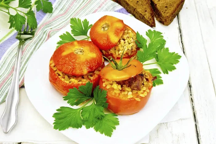 Framed Print : Tomatoes stuffed with meat and steamed wheat bulgur in a white plate