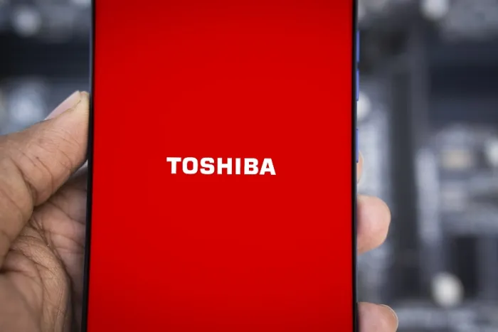 Framed Print : Toshiba logo is displayed on smartphone