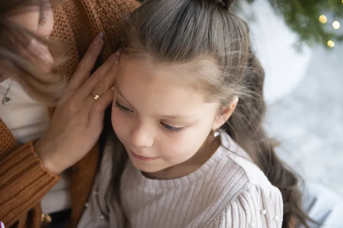 Framed Print : A touching scene captures a young girl looking down