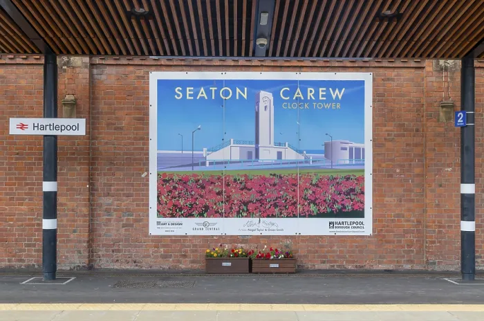 Framed Print : Tourism promotion billboard poster at railway station