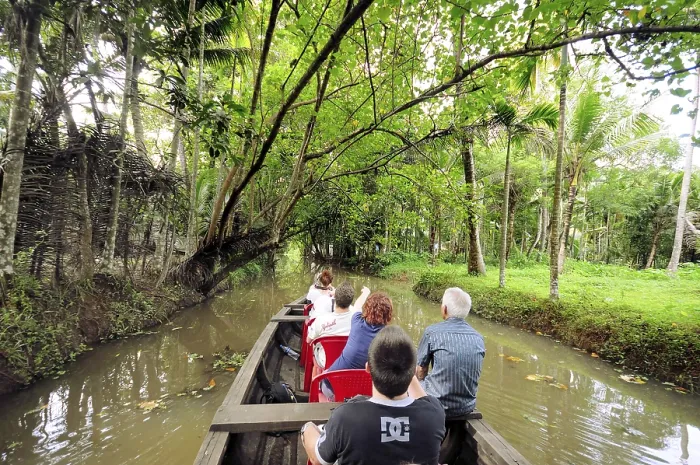 Framed Print : Tourists on boat in backwater, Ernakulam