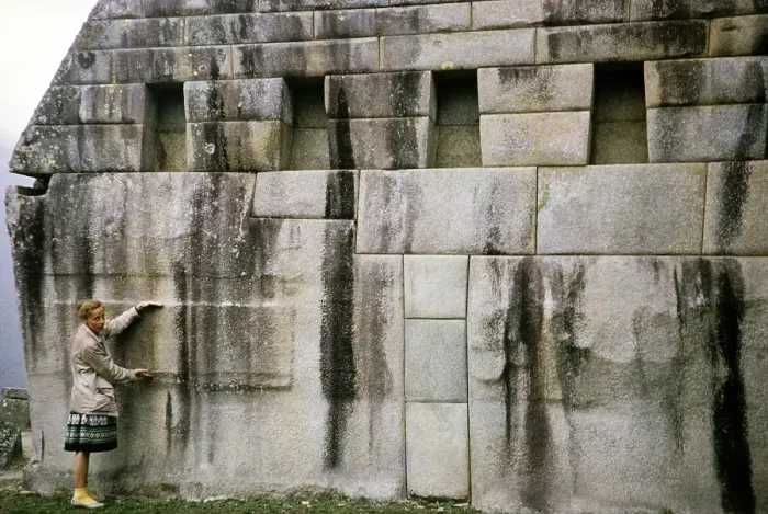 Framed Print : Tourists standing in front of huge stone blocks used for Inca masonry, Machu Picchu, Peru, South America, around 1962, South America
