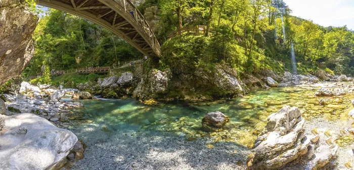 Framed Print : Tourists walking on a wooden bridge over a clear turquoise river in tolmin gorge Framed Print : Tourists walking on a wooden bridge over a clear turquoise river in tolmin gorge