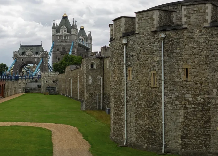 Framed Print : Tower view beyond historic stone walls and pathway at The Tower of London