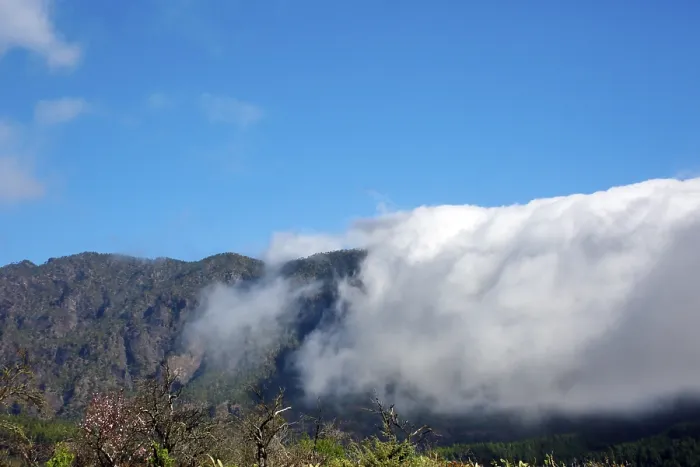 Framed Print : Trade wind clouds roll over the mountains of the Cumbre Vieja
