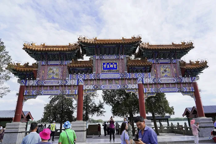 Framed Print : Traditional Chinese gate with ornate architecture and people below
