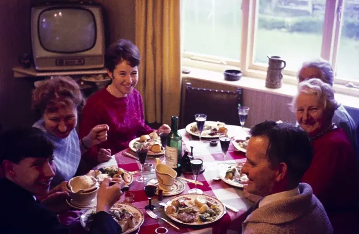 Framed Print : Traditional family Christmas meal all sitting around table eating and drinking, c 1960, England, UK