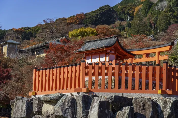 Framed Print : Traditional Japanese temple in a valley surrounded by autumn colors and mountains