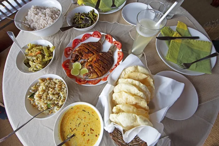 Framed Print : Traditional Kerala dishes, striped cichlid in the centre