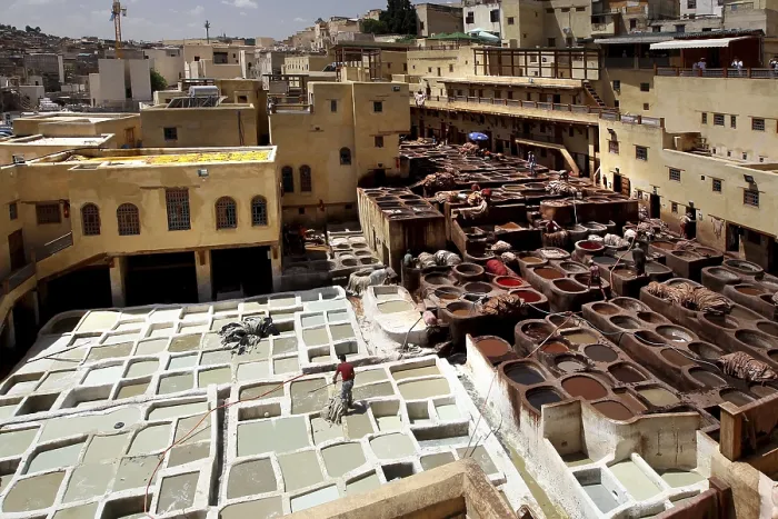 Framed Print : Traditional leather tannery in Fez with numerous paint basins and surrounding ancient architecture