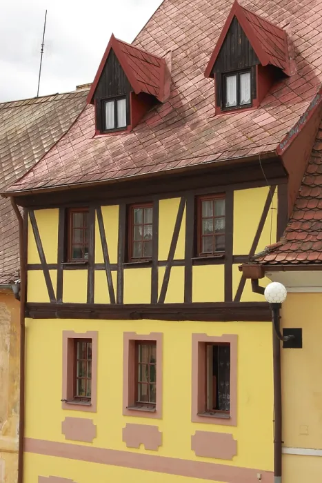Framed Print : Traditional timbered house with red roof clay tiles
