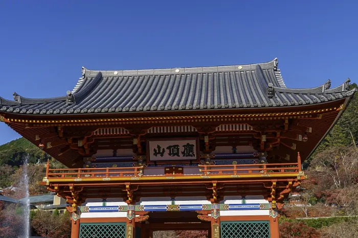 Framed Print : A traditionally designed Japanese temple building against a blue sky