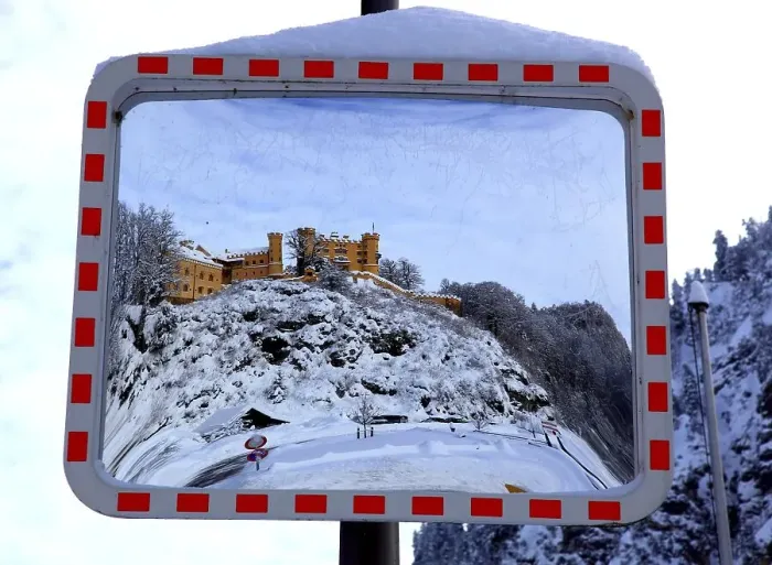 Framed Print : A traffic mirror shows Hohenschwangau Castle in winter