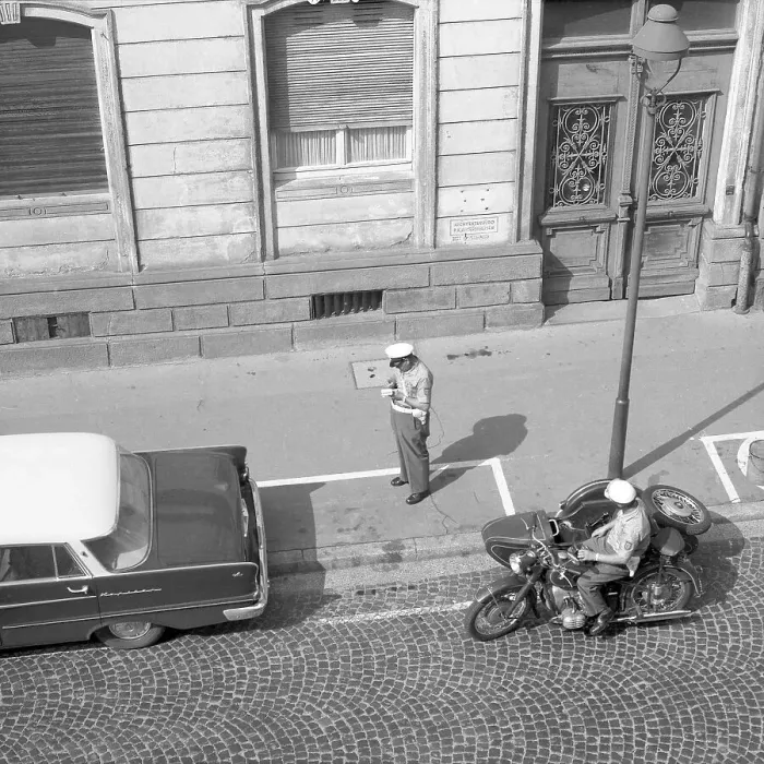 Framed Print : Two traffic policemen handing out a parking ticket to a car parker around 1950 Framed Print : Two traffic policemen handing out a parking ticket to a car parker around 1950