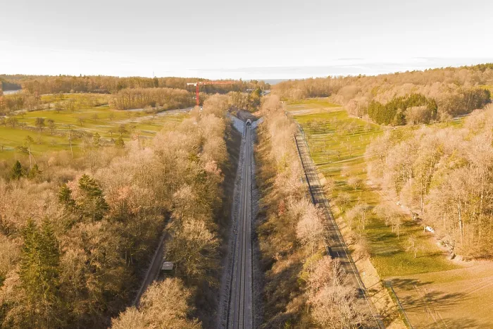Framed Print : Train route from above, flanked by autumnal forests