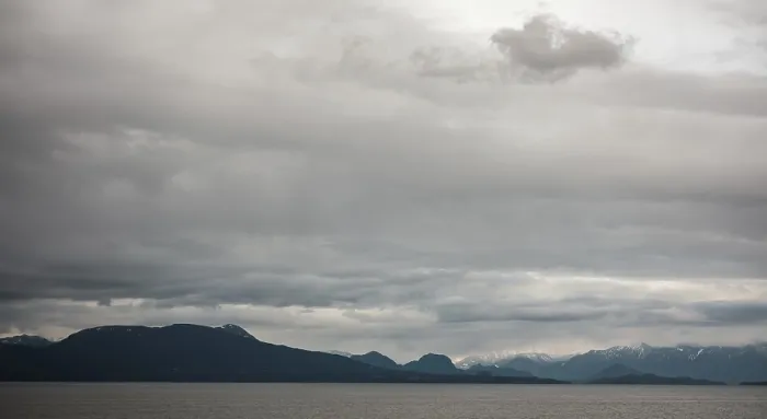 Framed Print : A tranquil seascape with mountains