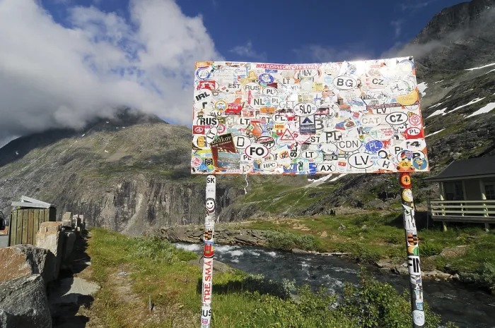 Framed Print : With transfer pictures pasted place-name sign at the Trollstigen Framed Print : With transfer pictures pasted place-name sign at the Trollstigen