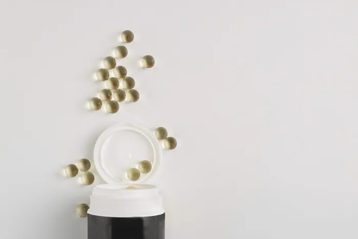 Framed Print : Transparent capsules spilled out of a jar