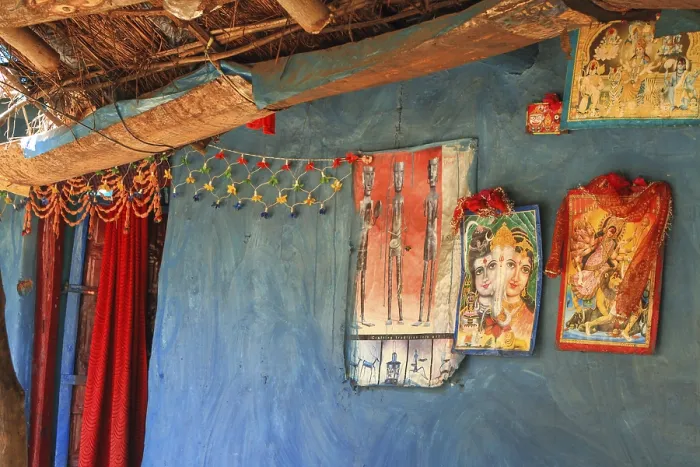 Framed Print : Tribal hut with picture of gods