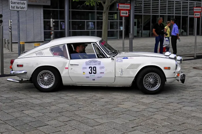Framed Print : Triumph GT6, stylish white classic car taking part in a rally Framed Print : Triumph GT6, stylish white classic car taking part in a rally