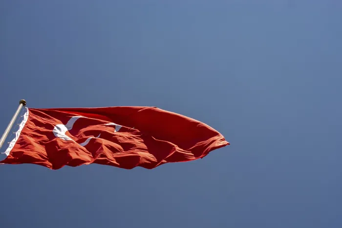 Framed Print : Turkish national flag with white star and moon on a pole in sky