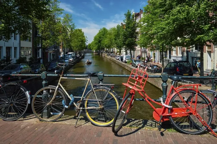 Framed Print : Typical Amsterdam view, Amsterdam canal with boats and bicycles on a bridge Amsterdam
