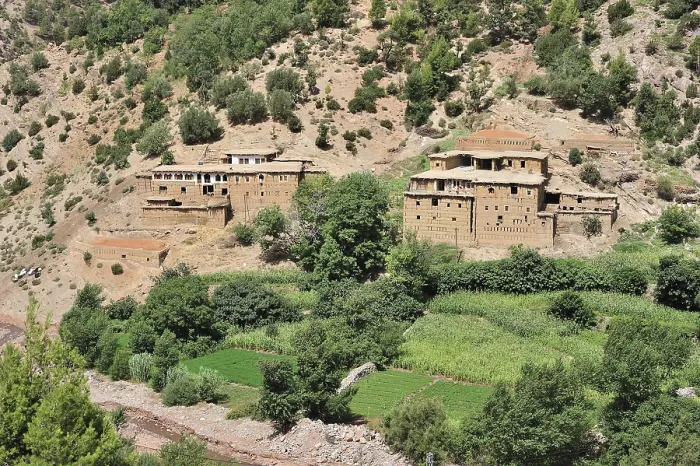 Framed Print : Typical Berber village with traditional adobe houses and small kasbahs in the mountains of the High Atlas Framed Print : Typical Berber village with traditional adobe houses and small kasbahs in the mountains of the High Atlas