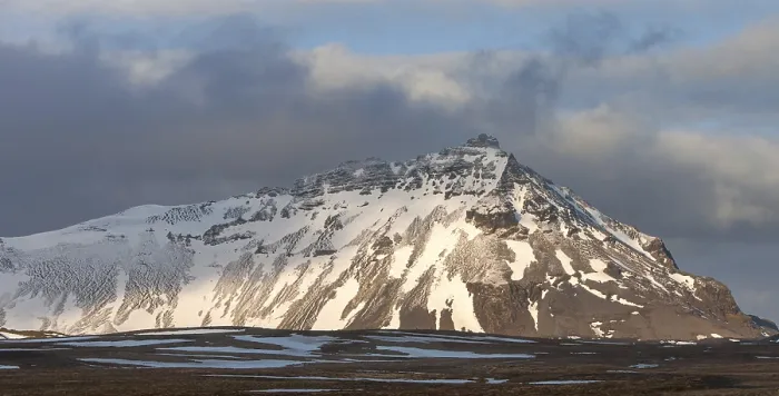 Framed Print : Typical Icelandic landscape with mountains and meadow land covered in snow at snaefellsnes peninsula in Iceland