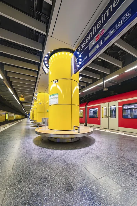Framed Print : Underground station with striking yellow columns and urban ambience