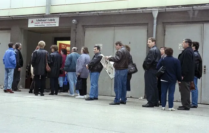 Framed Print : Unemployed people in a queue at the Leipzig job centre