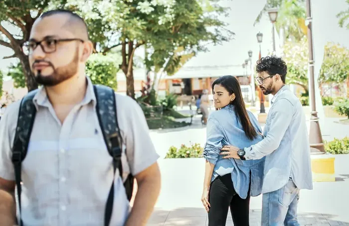 Framed Print : Unfaithful girlfriend looking at another man on the street