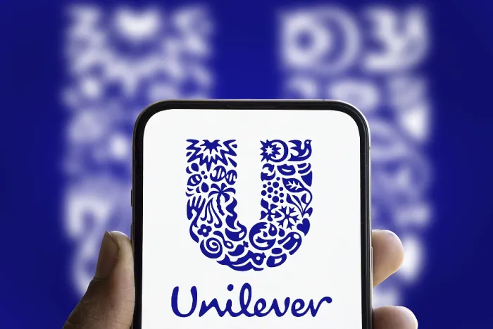 Framed Print : unilever logo is displayed on smartphone