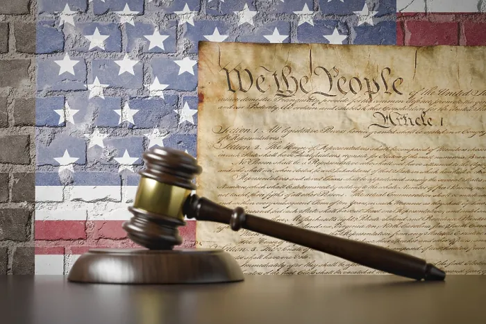 Framed Print : United states constitution and american flag on wall with gavel resting on table in front