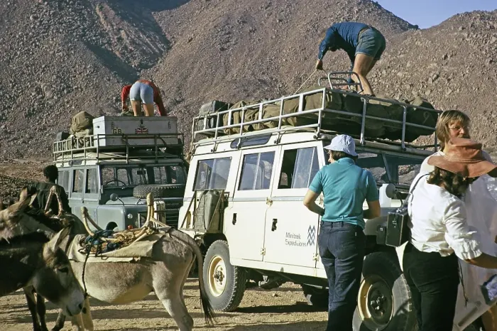 Framed Print : Unloading tourists and baggage, Landrovers of MIntrek Expeditions Ltd, Tassili N'Ajjer National Park, near Djanet, Algeria, north Africa 1973, Africa