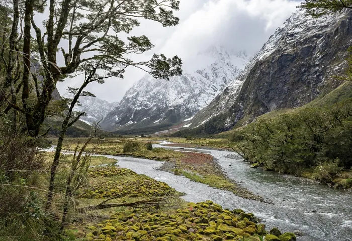 Framed Print : Valley with snow-capped mountains