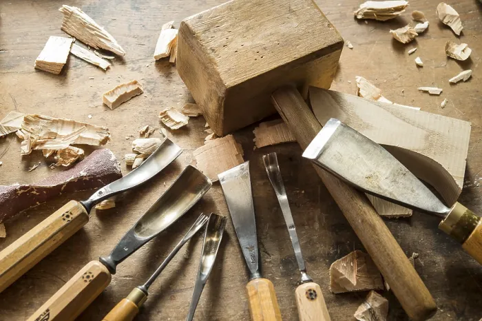 Framed Print : Various woodworking tools on a workbench