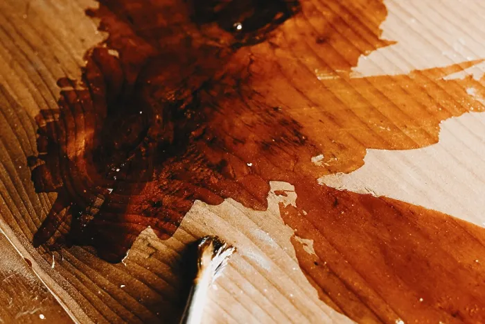Framed Print : Varnish and a brush on a wooden surface with visible texture Framed Print : Varnish and a brush on a wooden surface with visible texture