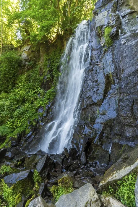 Framed Print : Vaucoux waterfall cascades gracefully over dark rocks