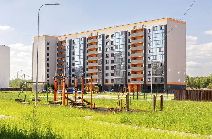 Framed Print : Veliky, Russia - August.29.2024 : New residential building with a modern playground in the city courtyard