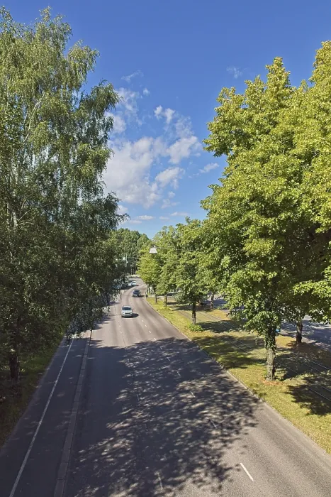 Framed Print : View of empty asphalt Makelankatu street on a sunny summer day