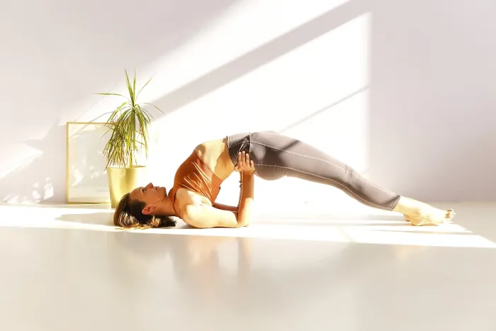 Framed Print : Side view of calm female in sportswear practicing yoga in Firefly pose while balancing on arms