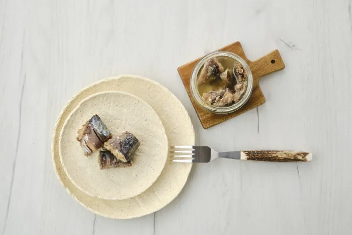 Framed Print : Top view of canned mackerel on a plate
