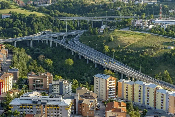 Framed Print : View from Castello Monforte over apartment blocks and motorway junction