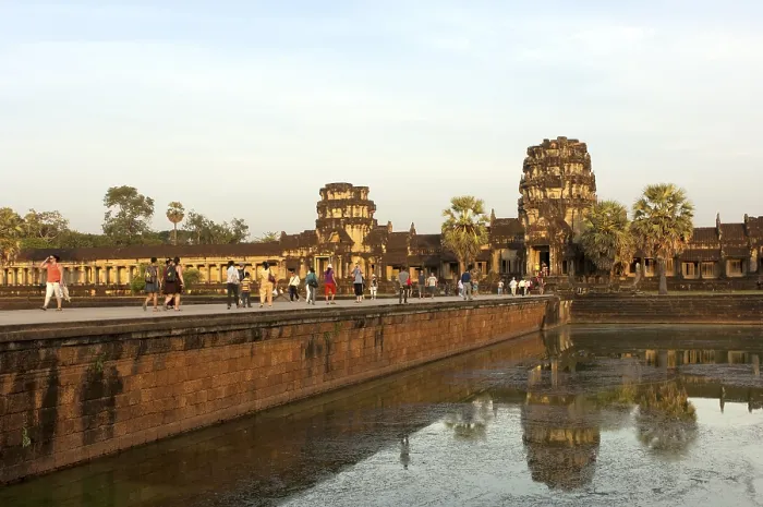 Framed Print : View across the castle bridge on the west wing of the Angkor Wat temple complex in the evening light Framed Print : View across the castle bridge on the west wing of the Angkor Wat temple complex in the evening light