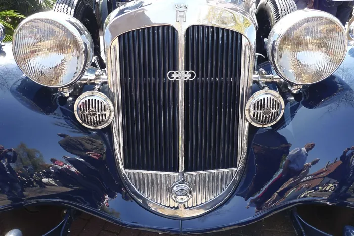 Framed Print : Front view of a classic car with double round headlights and shiny front grille Framed Print : Front view of a classic car with double round headlights and shiny front grille