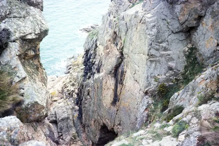 Framed Print : View from the cliff to the cave entrance of La Cotte de St Brelade, Palaeolithic archaeological site, Jersey, Channel Islands 1976, Europe Framed Print : View from the cliff to the cave entrance of La Cotte de St Brelade, Palaeolithic archaeological site, Jersey, Channel Islands 1976, Europe